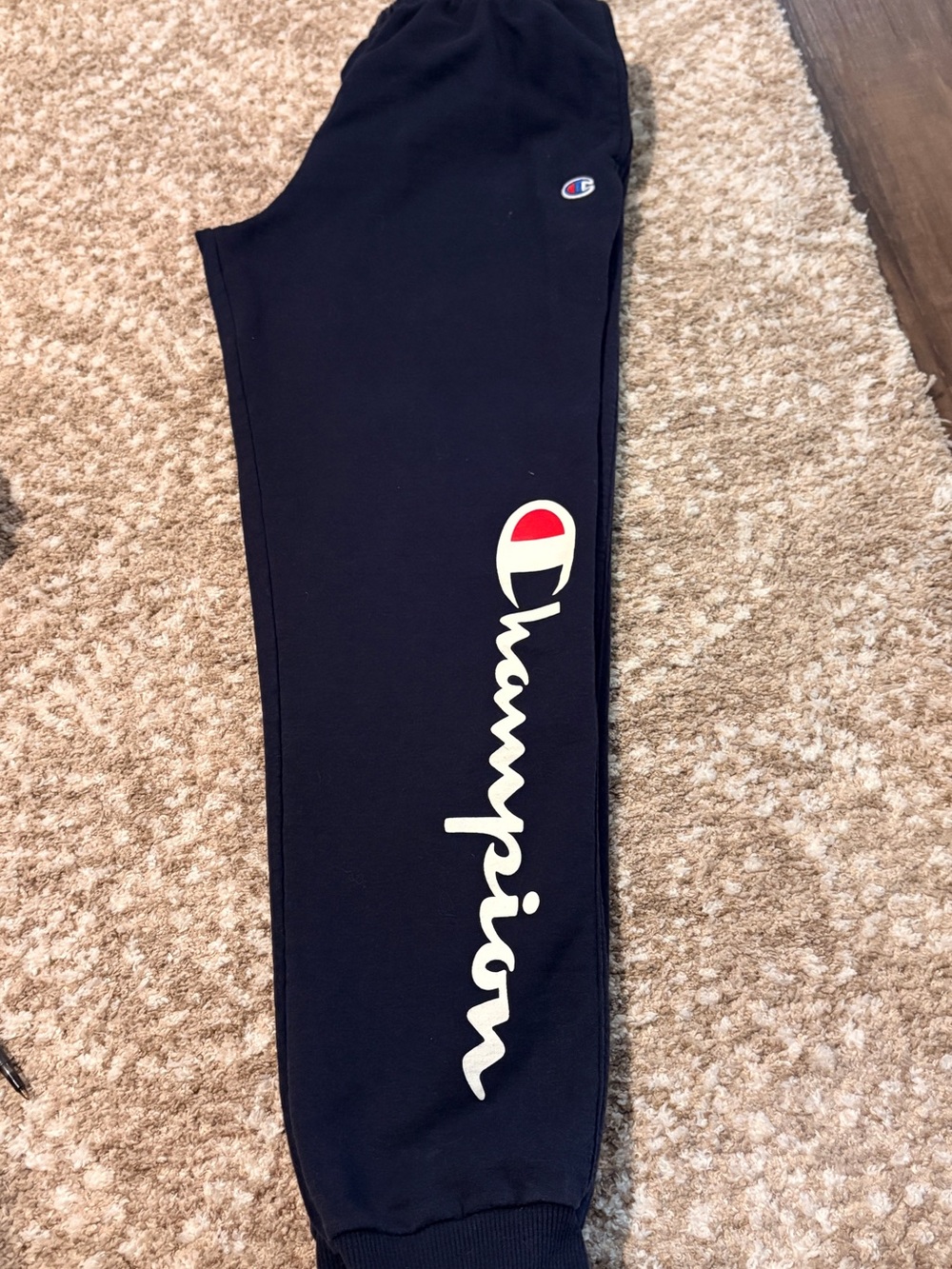 Champion Black Sweatpants with White Script Logo and Red Accent